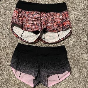 2 pairs of lululemon shorts, 2 inch/ red ones are size 4 / pink ones are size 2